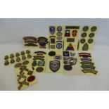 A large quantity of military cloth badges.