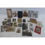 Twenty two WW1 Imperial German photographs and postcards with a German Bible and booklet.