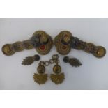 A pair of Northumberland Fusiliers Victorian epaulettes and a cape clasp.