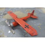 A decorative model of a German WWI fighter bi-plane.
