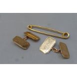 A pair of monogrammed 9ct gold cufflinks and a 9ct gold pin, approximate weight 7.1g.