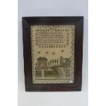 An early 19th Century faux rosewood framed sampler decorated with a Georgian house and garden, and a