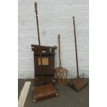 Two oak Ewbank carpet sweepers, a cane carpet beater and a trouser press.