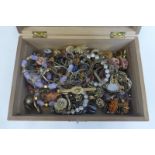 A box of assorted costume jewellery including silver.