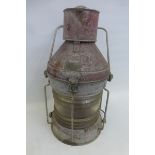 A large galvanised ship's port lantern with numbered plaque inscribed "Meteorite".