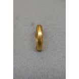 A 22ct gold wedding band, approximately 8g.