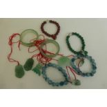 An assortment of jade and agate jewellery.