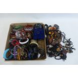 A box of assorted costume jewellery including silver and gold.