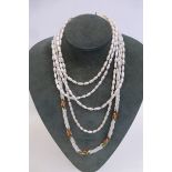 Three seed pearl necklaces.