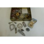 A box of assorted costume jewellery including silver.