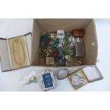 A box of assorted costume jewellery including beads and silver.