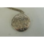 A silver locket and chain.