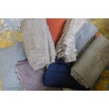 A quantity of assorted dressmaker's tweed material in various patterns.