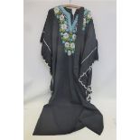 A lady's 1960s/70s embroidered kaftan decorated with daisies.