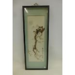 A Chinese cased study of birds in a tree in blossom, signed lower right.