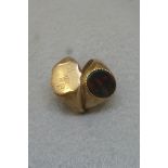 A 9ct gold signet ring and a 9ct gold ring set with a blood stone, approximately 7.7g.