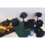 A box of Brownies', Cub's, Scout's and Girl Guide's shirts, sashes, caps, hats, belts, etc. for