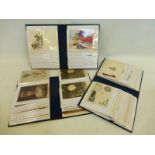 A boxed set of three albums of 130 military postcards and Christmas cards.