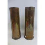 Two large WWI brass shell cases approximately 11 1/2" by 4" diameter.