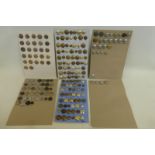 A large quantity of military and other buttons mounted on six display cards.
