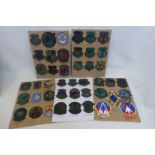 Forty five United States Sir Force embroidered cloth badges mounted on cards.