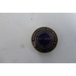 A WWI Armstrong Whitworth Munitions Imperial Service of War gilt and enamel lapel badge