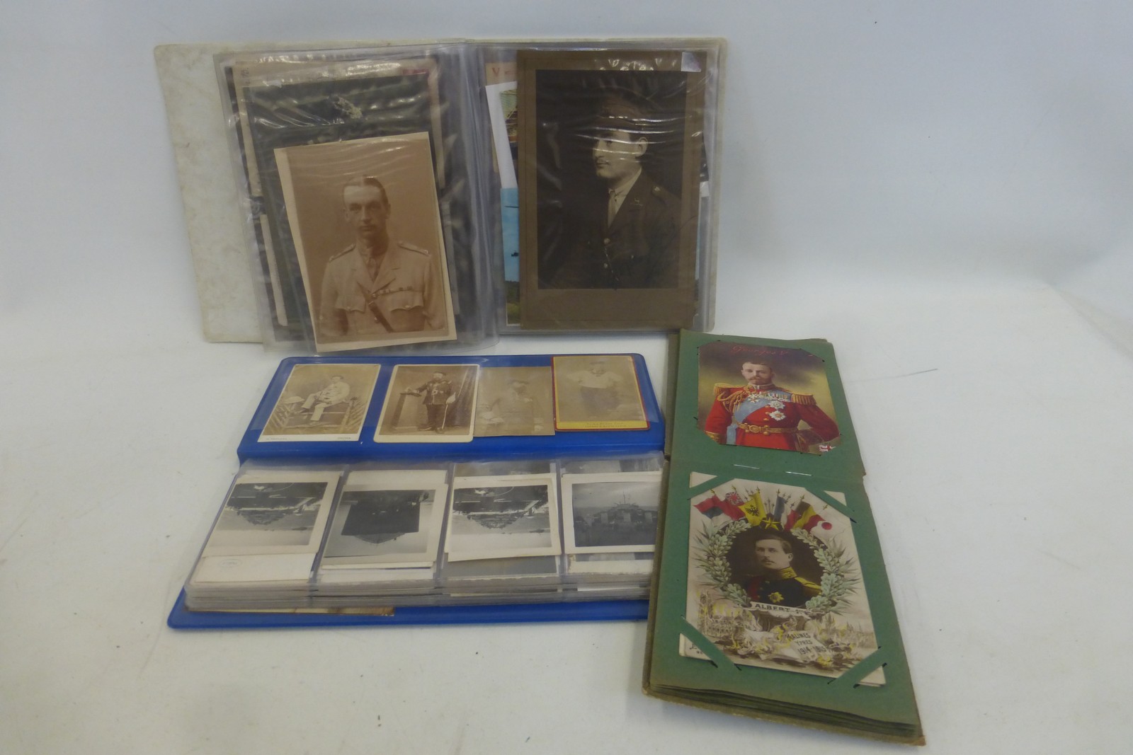 Three albums containing a total of 134 photographs and postcards.