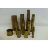 An assortment of 12 WWI and later brass shell cases the largest being approximately 9 x 3 3/4".