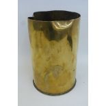 A 1915 dated brass mortar shell case approximately 9 7/8" high and 6 5/8" diameter.