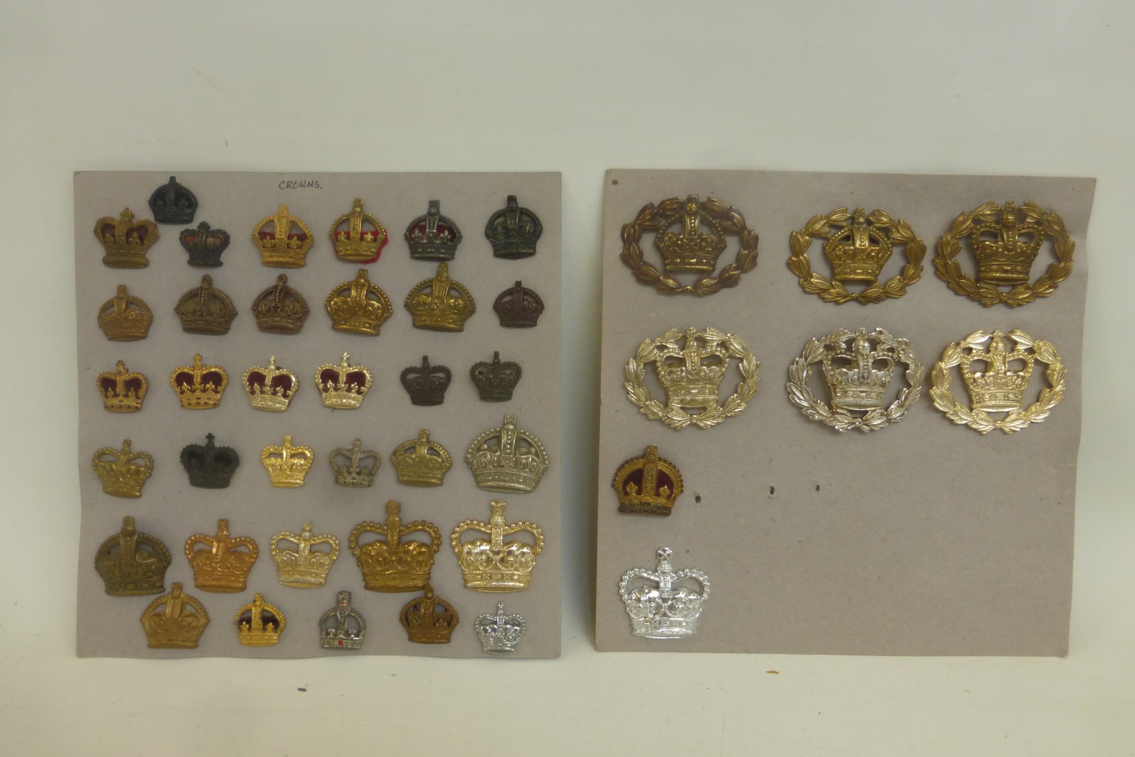 Two display cards of 43 military Kings and Queens crowns.