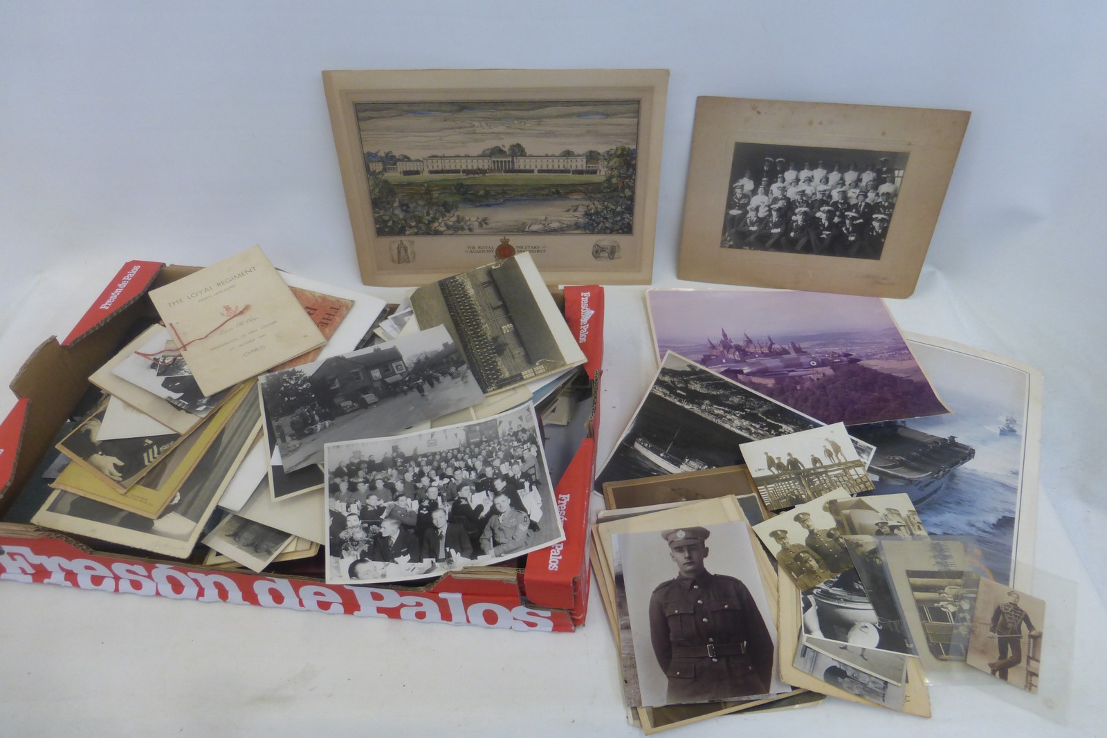 A large box of hundreds of mainly military photographs, postcards and items of ephemera.