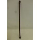 A leather covered wood swagger stick approximately 24" overall length.