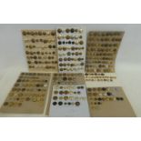 A large quantity of military and other buttons mounted on eight display cards.