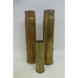 A pair of brass shell cases dated 1917 (approximately 12 1/4 x 3") and a 1941 dated shell case (