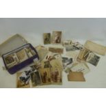 A shoe box full of original military photographs, postcards and ephemera.