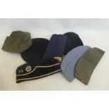 Seven assorted berets and caps.