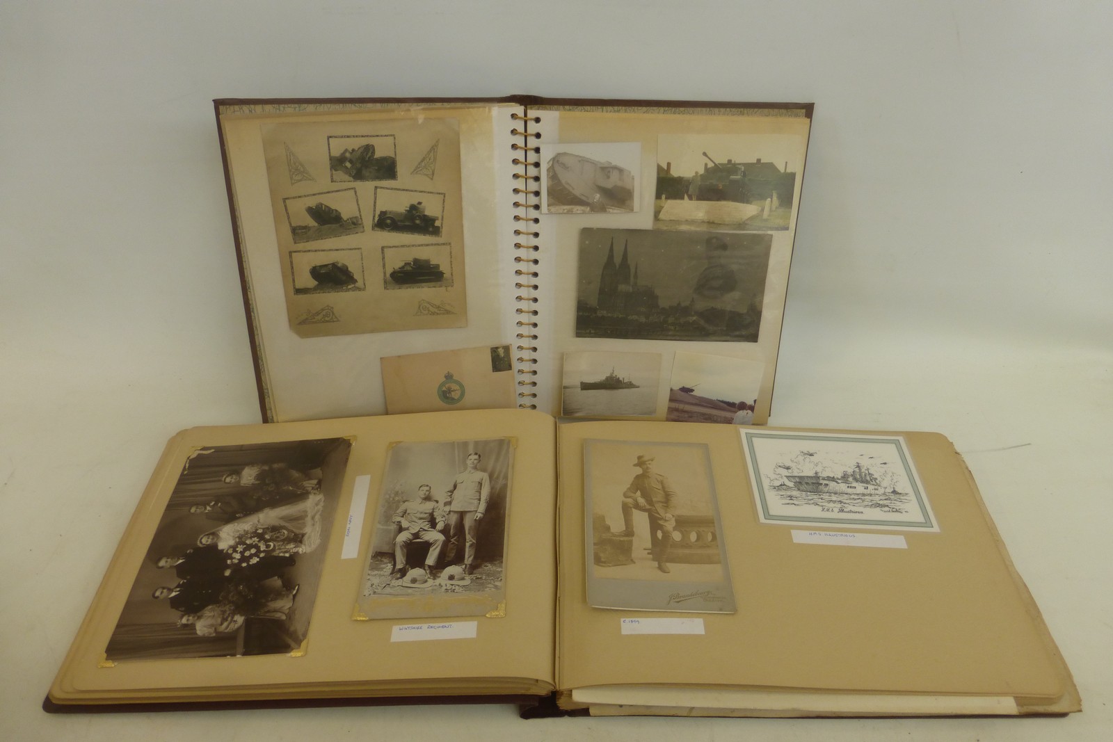 Two albums of more than 80 interesting military photographs and Christmas cards.