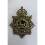 An early 20th Century Hampshire Regiment helmet plate with centre, retains its lugs to the