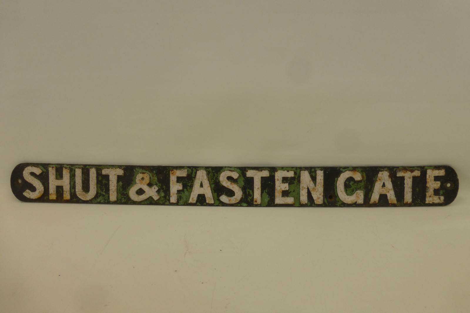 An original cast iron railway sign - "Shut and Fasten Gate", 33 1/2 x 3".