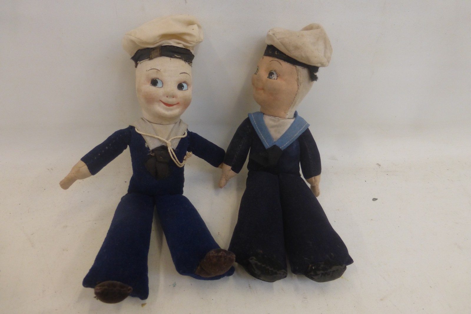 Two early 20th Century felt covered sailors,one with a hatband inscribed 'Pride of London'.