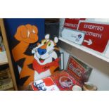 A selection of signage including a "Tony the Tiger" cut out sign.