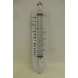 A small white enamel thermometer, 4 1/2 x 20 1/2".