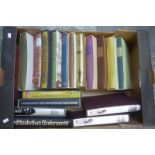 A box of assorted Folio Society volumes.