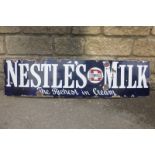 A Nestle's Milk "the richest in cream" rectangular enamel sign, 48 1/2 x 12".