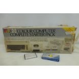 A Vic 20 Colour Computer complete starter pack with a Commodore Vic 20 cassette unit, a free Vic