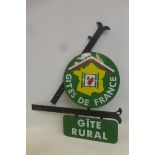 A "Gites de France" double sided two piece enamel sign on retail bracketry.