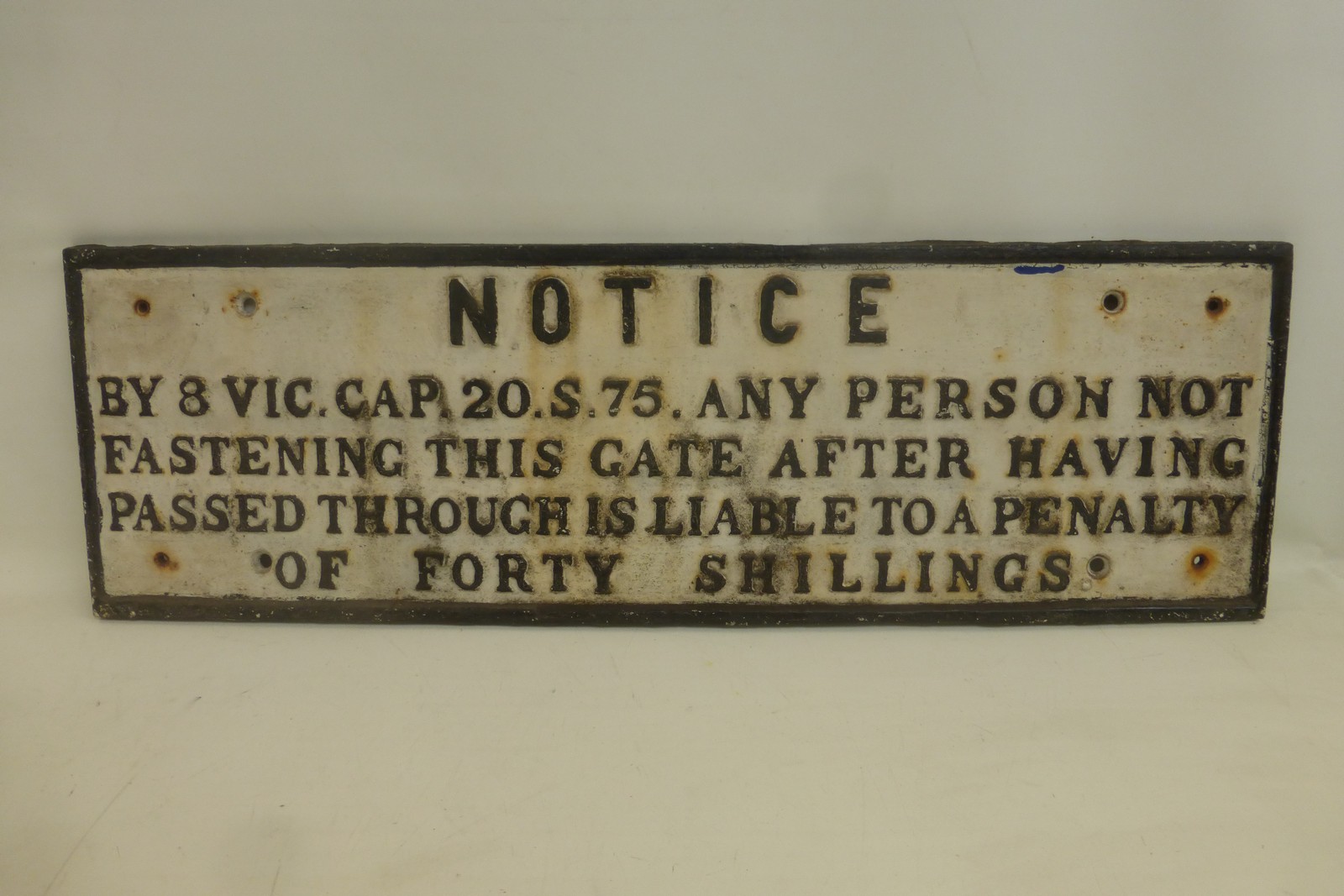 An original cast iron railway sign- "Notice by 8 Vic.Cap.20.S.75", 31 x 9 3/4".