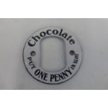 A "Chocolate Put One Penny in Slot" circular enamel vending machine escutcheon in excellent