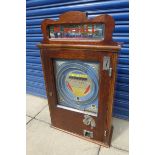 An oak cased 'Playball' amusement arcade slot machine.