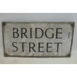 A rectangular enamel/street sign for "Bridge Street", 24 3/4 x 12 3/4".